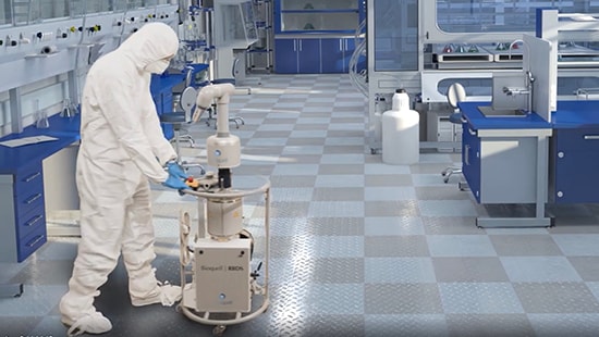 Ecolab Bioquell technician setting up an RBDS system in a cleanroom