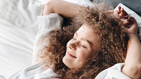 Woman smiling in bed