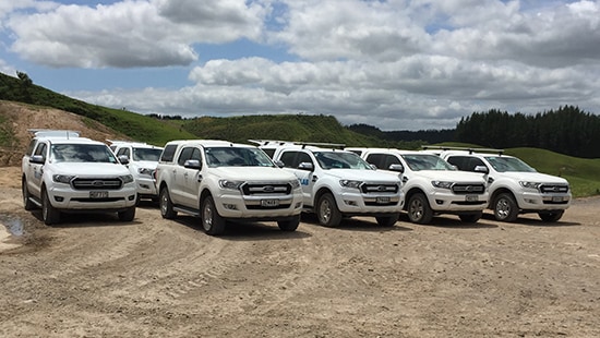 Maxwell Farms fleet of white vehicles