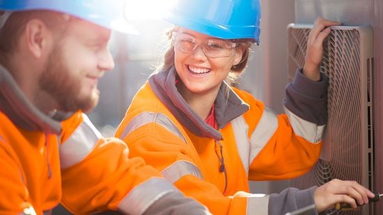 Hard hat workers smiling